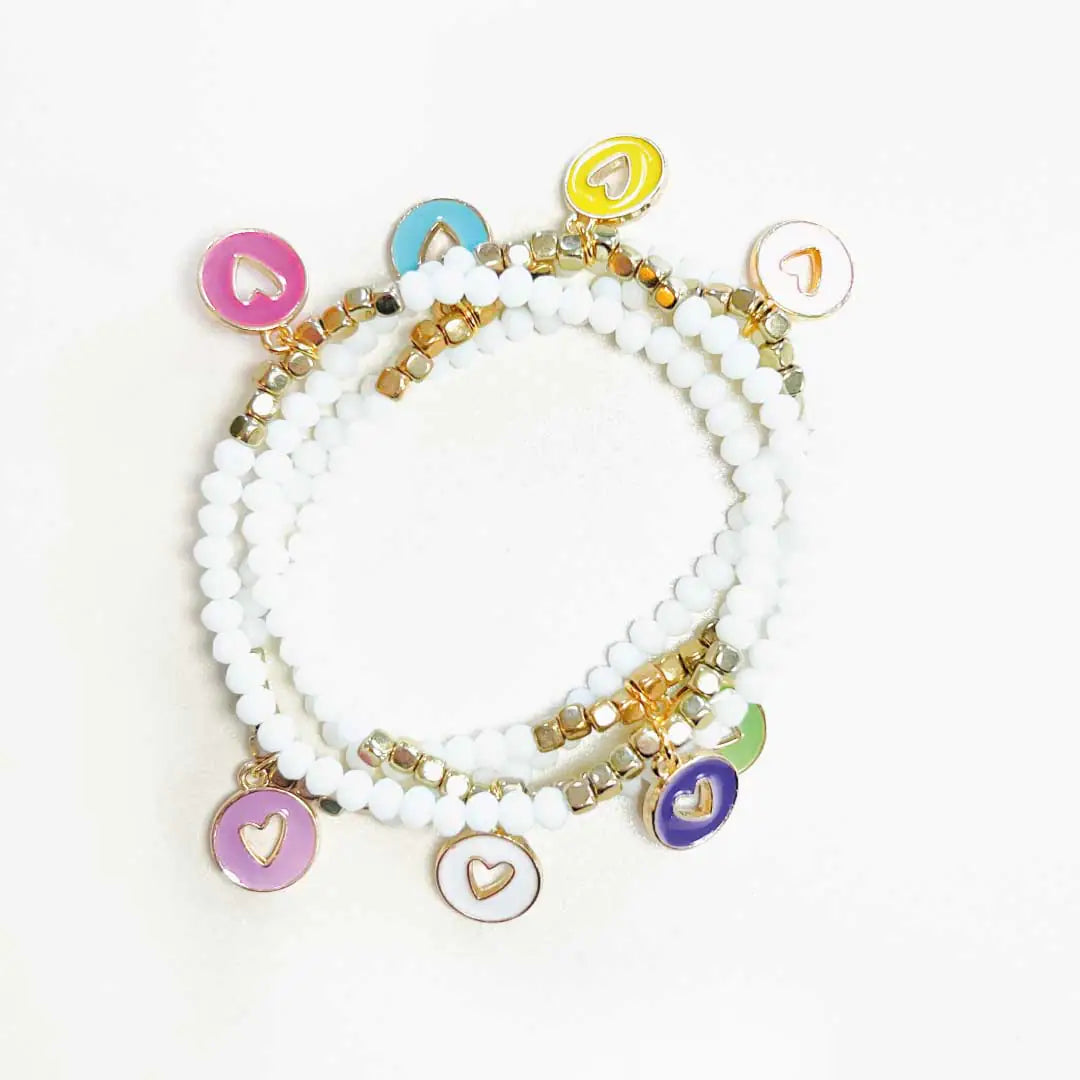 Colorful stack of 4 hand-beaded charm bracelets with enamel-filled heart charms.